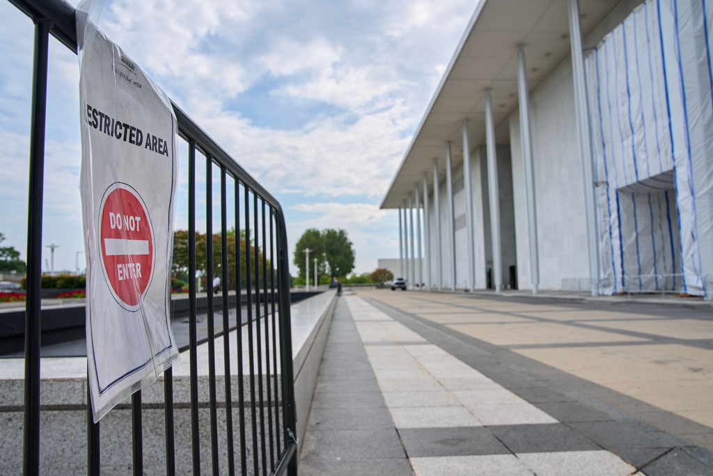 A sign directs people away from the Kennedy Center, which has been fenced off and closed to the public, Thursday, Sept. 17, 2026, in Washington. (AP Photo/Jacquelyn Martin)