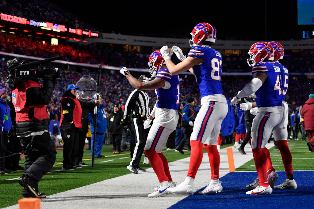 Buffalo Bills players celebrate after a touchdown in the second half of an NFL football game against the New York Jets Sunday, Jan. 4, 2026, in Orchard Park, N.Y. (AP Photo/Adrian Kraus)