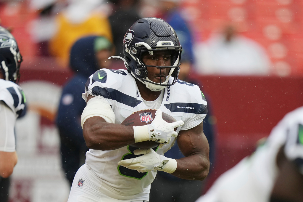Seattle Seahawks running back Jadarian Price (8) with the ball during warm ups before the start of an NFL football game against Washington Commanders, Sunday, Sept. 27, 2026 in Landover, Md. (AP Photo/Stephanie Scarbrough)