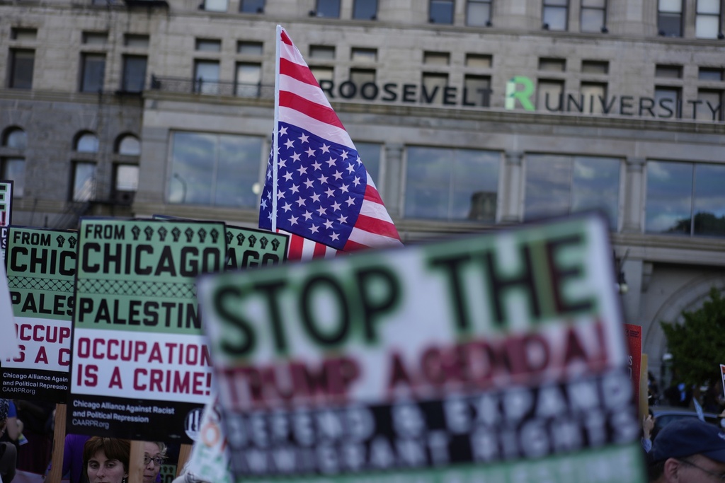 People march during Illinois Coalition for Immigrant & Refugee Rights' "Chicago Says No Trump No Troops" protest Saturday, Sept. 6, 2025, in Chicago. (AP Photo/Carolyn Kaster)