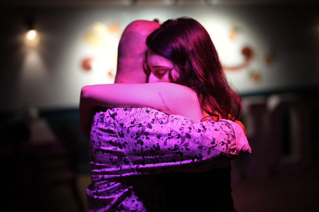 A tattoo in Spanish reading "There is no law" adorns the arm of a woman dancing during a tango milonga session at Soho Tangoport in Istanbul, Turkey, Thursday, Jan. 29, 2026. (AP Photo/Francisco Seco)