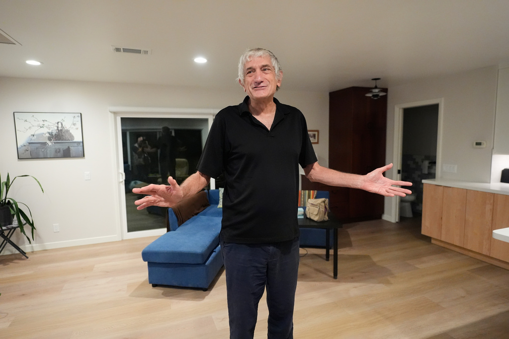 John Martinis stands in his living room after winning the Nobel Prize in Physics for his work on quantum tunneling on Tuesday, Oct. 7, 2025, in Santa Barbara, Calif. (AP Photo/Mark J. Terrill)