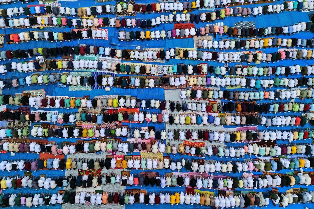 Muslims perform Eid al-Fitr prayers to mark the end of the holy fasting month of Ramadan in Guwahati, India, Saturday, March 21, 2026. (AP Photo/Anupam Nath)