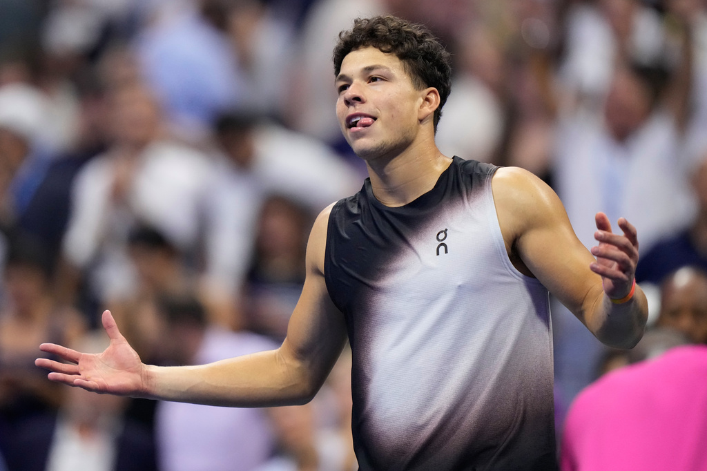 Ben Shelton, of the United States, reacts after he won his match against Frances Tiafoe, of the United States, during the men's singles semifinals of the U.S. Open tennis championships Friday, Sept. 11, 2026, in New York. (AP Photo/Frank Franklin II)