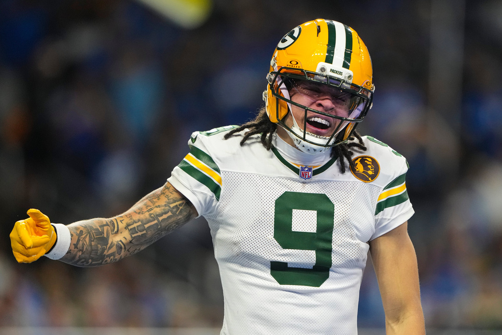 Green Bay Packers wide receiver Christian Watson (9) celebrates a touchdown against the Detroit Lions during the second half an NFL football game in Detroit, Thursday, Nov. 27, 2025. (AP Photo/Ryan Sun)