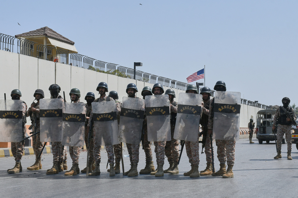 FILE - Paramilitary soldiers take positions at the U.S. Consulate after protesters stormed the building in Karachi, Pakistan, on March 1, 2026. (AP Photo/Ali Raza, File)