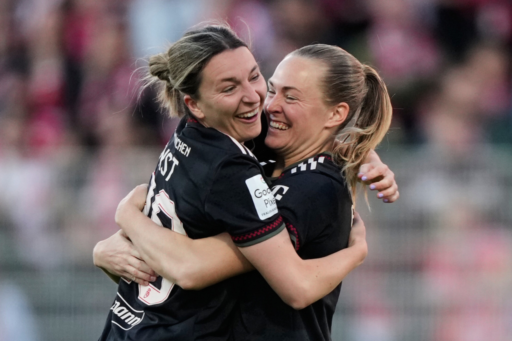 Bayern's Magdalena Eriksson, right, and Bayern's Barbara Dunst celebrate their side's second goal during a German women's Bundesliga soccer match between 1.FC Union Berlin and Bayern Munich in Berlin, Germany, Wednesday, April 22, 2026. (AP Photo/Ebrahim Noroozi)