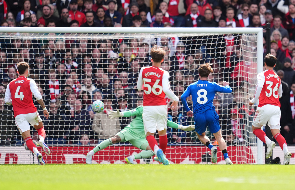 Bournemouth's Alex Scott scores his side's second goal of the game during the English Premier League soccer match between Arsenal and Bournemouth in London, England Saturday, April 11, 2026. (Adam Davy/PA via AP)