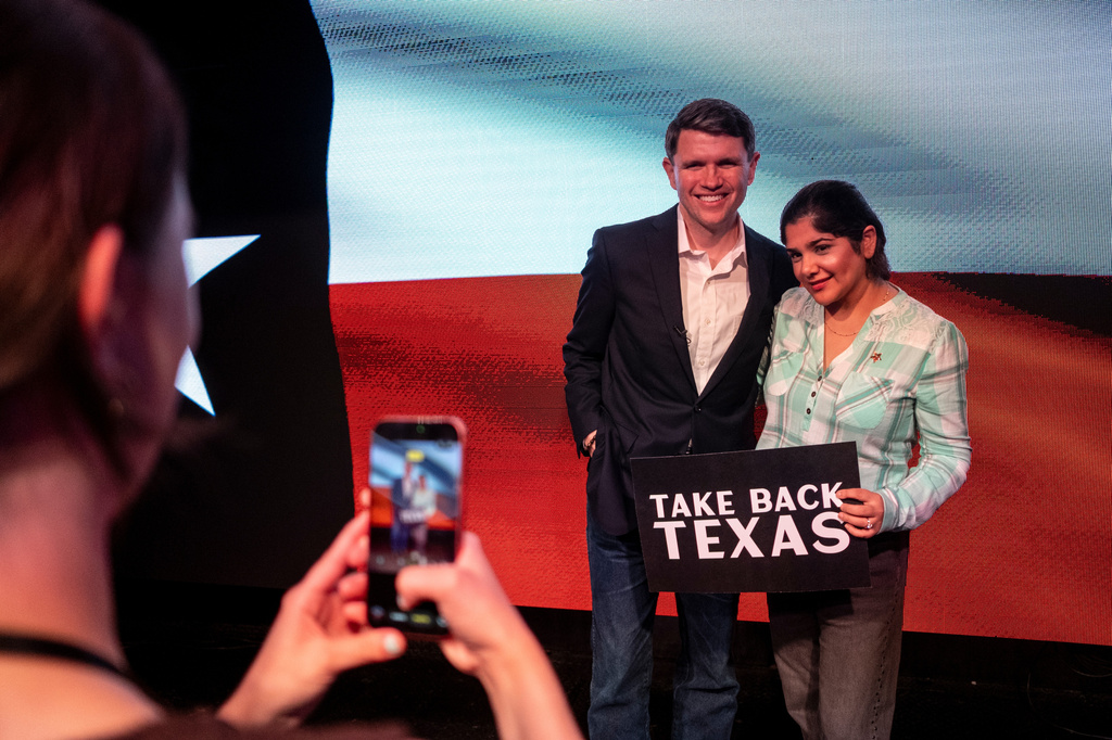 Texas state Rep. and Democratic Senate candidate James Talarico takes a photo with a supporter during a rally in Houston, Wednesday, May 27, 2026. (AP Photo/Joel Angel Juarez)