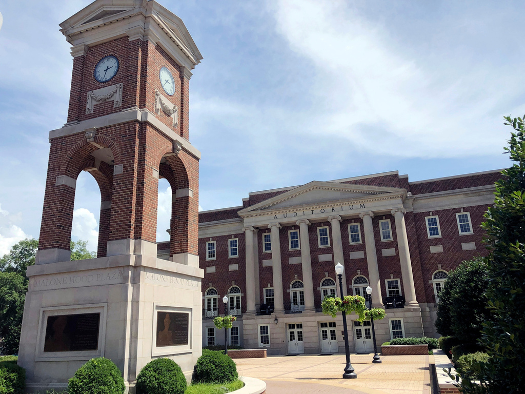 FILE - The Autherine Lucy Clock Tower at the Malone Hood Plaza stands in front of Foster Auditorium on the University of Alabama campus in Tuscaloosa, Ala., June 16, 2019. (AP Photo/Bill Sikes, File)