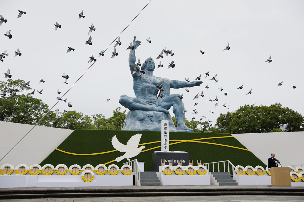 Doves are released over the Peace Statue during a ceremony to mark the 81st anniversary of the U.S. atomic bombing at the Peace Park in Nagasaki, southern Japan Sunday, Aug. 9, 2026. (Taichi Nagahisa/Kyodo News via AP)