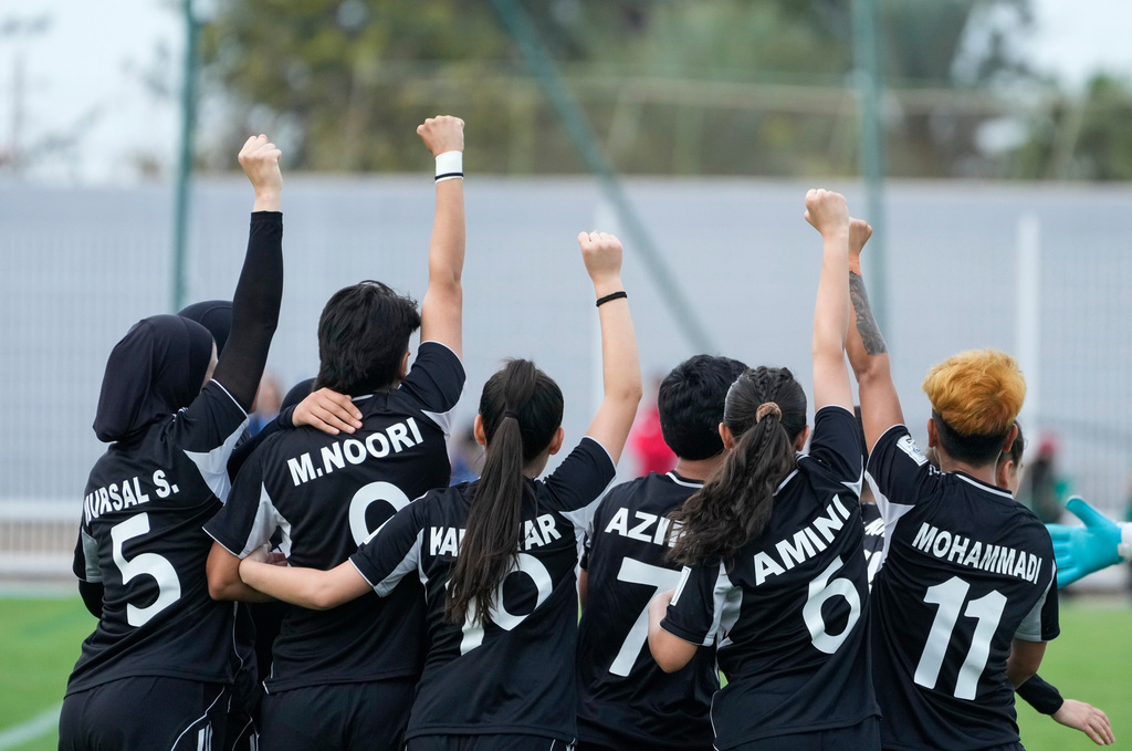 FILE - Members of Afghan Women United soccer team celebrate after scoring a goal against Chad, Sunday, Oct. 26, 2025, in Casablanca, Morocco, in their first international tournament since fleeing their country. (AP Photo/Mosa'ab Elshamy, File)
