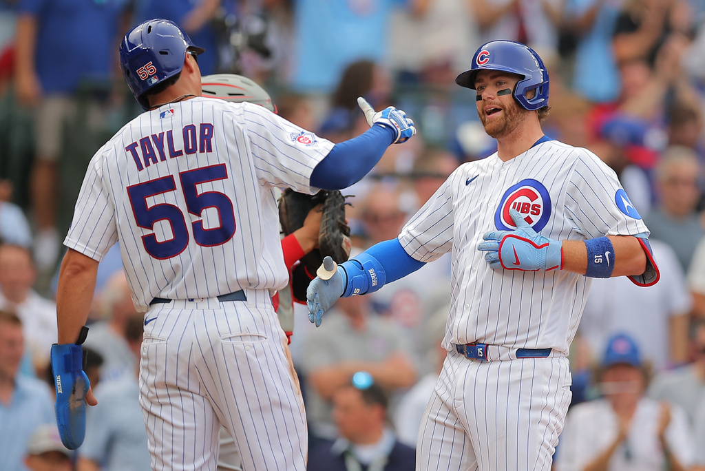 Chicago Cubs' Carson Kelly, right, celebrates with teammate Tyrone Taylor, left, after hitting a three-run home run during the fifth inning of a baseball game against the Cincinnati Reds, Saturday, Aug. 29, 2026, in Chicago. (AP Photo/Melissa Tamez)