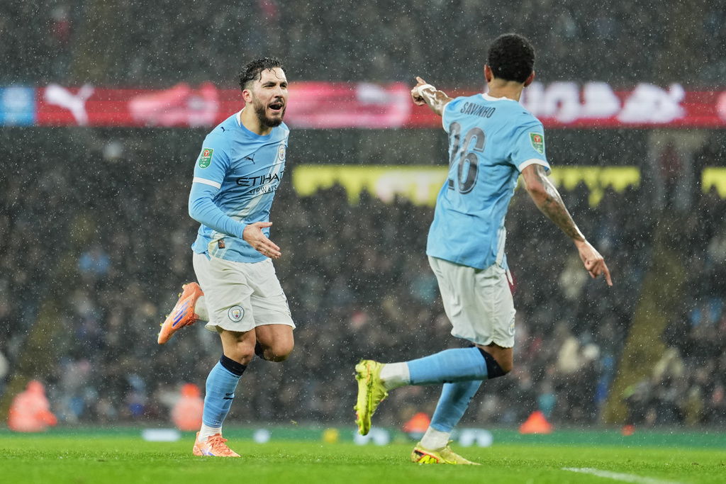 Manchester City's Rayan Cherki celebrates after scoring his side's first goal during the English League Cup soccer match between Manchester City and Brentford in Manchester, England, Wednesday, Dec. 17, 2025. (AP Photo/Jon Super)