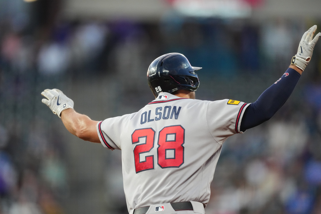Atlanta Braves' Matt Olson gestures to the bullpen as he circles the bases after hitting a solo home run off Colorado Rockies starting pitcher Jose Quintana in the fourth inning of a baseball game Friday, May 1, 2026, in Denver. (AP Photo/David Zalubowski)