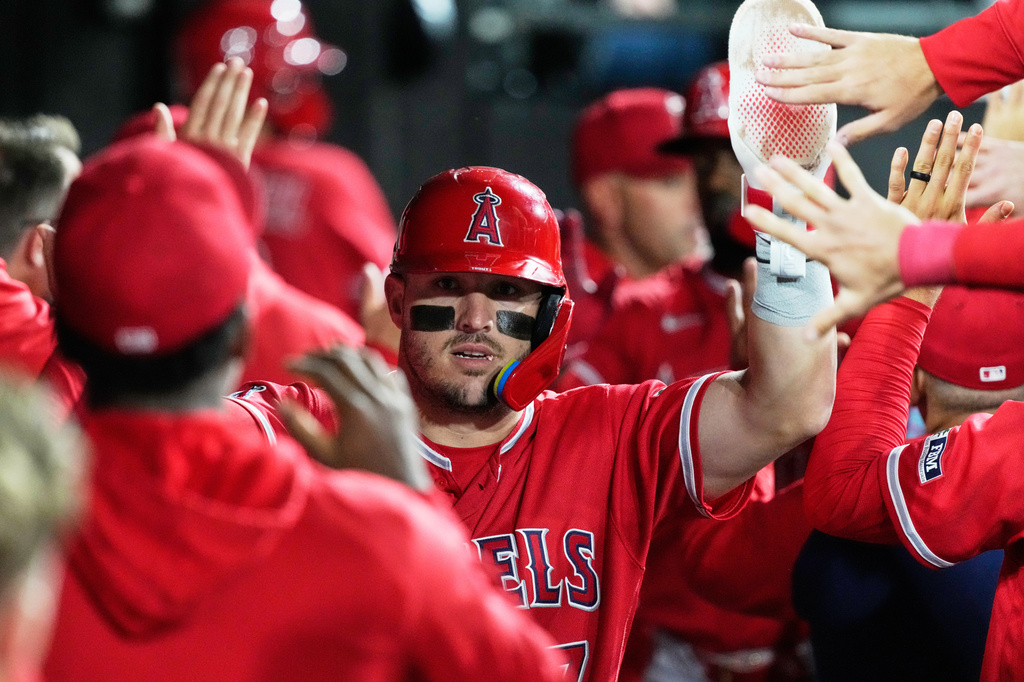 Los Angeles Angels' Mike Trout celebrates with teammates after scoring on a sacrifice fly by Jorge Soler during the first inning of a baseball game against the Chicago White Sox in Chicago, Monday, April 27, 2026. (AP Photo/Nam Y. Huh)