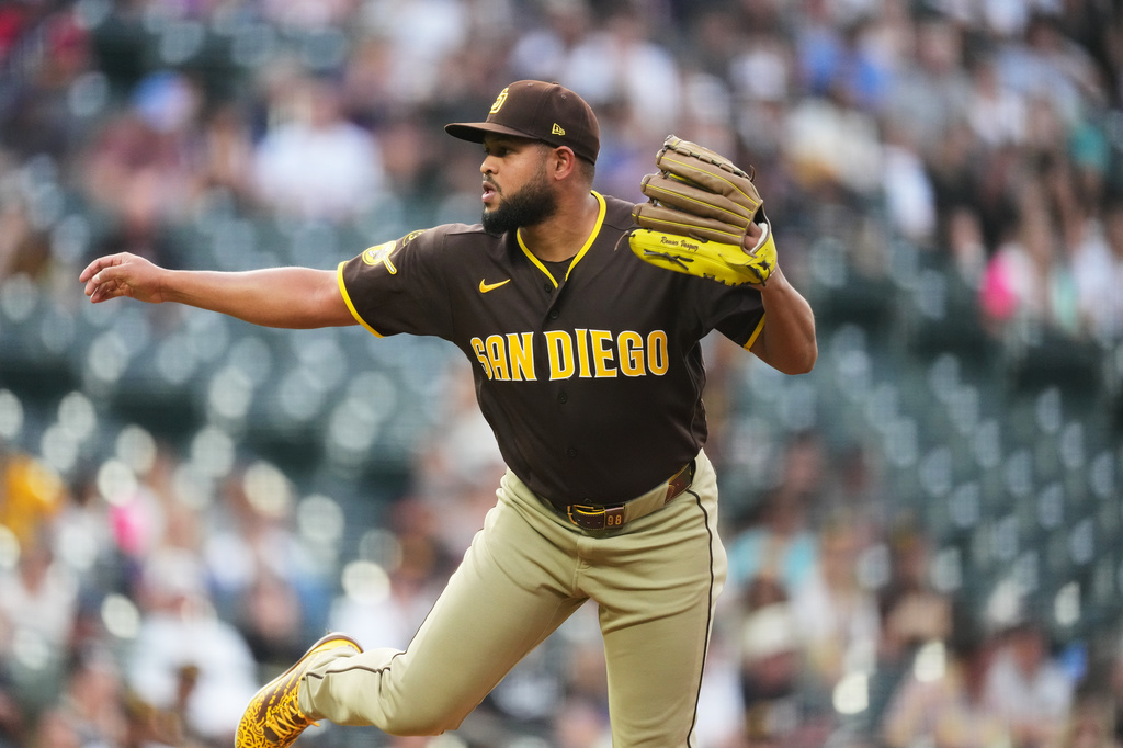 San Diego Padres starting pitcher Randy V·squez works against the Colorado Rockies in the first inning of a baseball game Tuesday, April 21, 2026, in Denver. (AP Photo/David Zalubowski)