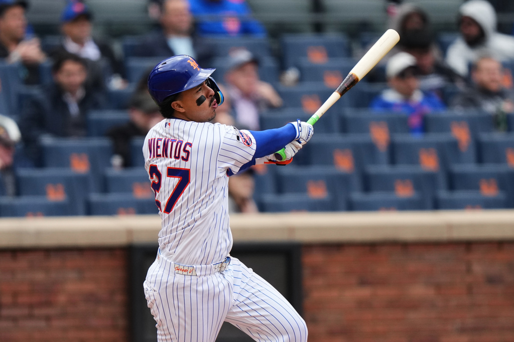New York Mets' Mark Vientos (27) follows through on a RBI double during the sixth inning of a baseball game against the Washington Nationals Thursday, April 30, 2026, in New York. (AP Photo/Frank Franklin II)