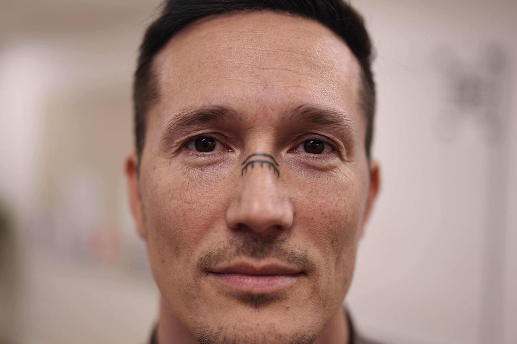 Juno Berthelsen, MP for the Naleraq opposition party that campaigns for independence in the Greenlandic parliament poses for photo at his office in Nuuk, Greenland, Thursday, Jan. 15, 2026. (AP Photo/Evgeniy Maloletka)