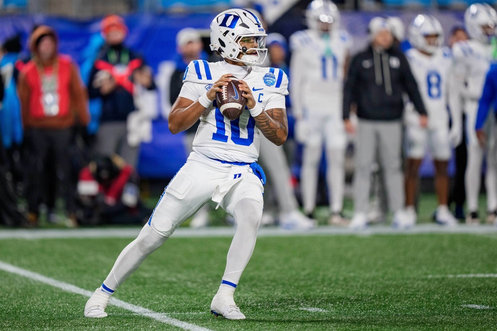 FILE - Duke quarterback Darian Mensah (10) drops back to pass during the Atlantic Coast Conference championship NCAA college football game between Virginia and Duke, Dec. 6, 2025, in Charlotte, N.C. (AP Photo/Jacob Kupferman, File)