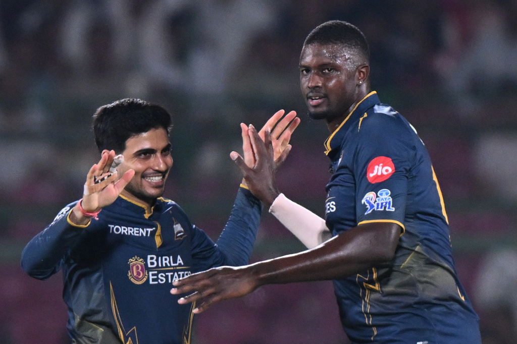 Gujarat Titans' Jason Holder, right, celebrates with Shubman Gill the wicket of Rajasthan Royals' Jofra Archer during the Indian Premier League cricket match between Rajasthan Royals and Gujarat Titans in Jaipur, India, Saturday, May 9, 2026. (AP Photo/ Str)