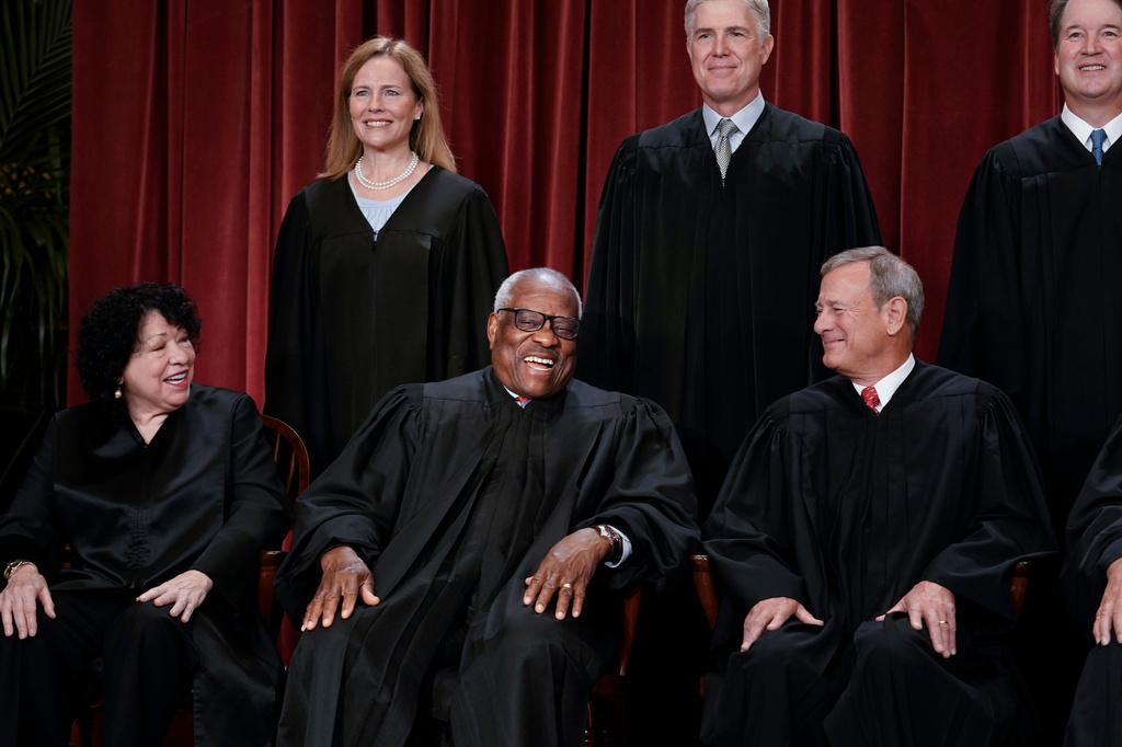 FILE - Members of the Supreme Court sit for a new group portrait following the addition of Associate Justice Ketanji Brown Jackson, at the Supreme Court building in Washington, Oct. 7, 2022. Bottom row, from left, Associate Justice Sonia Sotomayor, Associate Justice Clarence Thomas, and Chief Justice of the United States John Roberts. Top row, from left, Associate Justice Amy Coney Barrett, Associate Justice Neil Gorsuch, and Associate Justice Brett Kavanaugh. (AP Photo/J. Scott Applewhite, File)