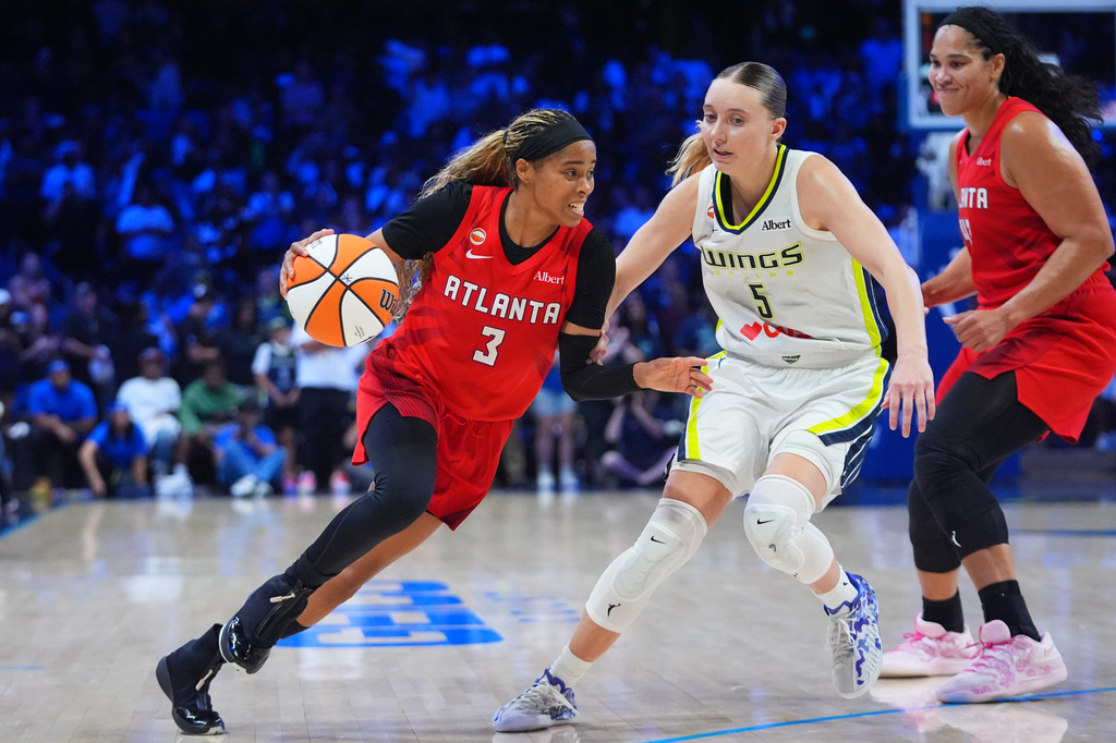Atlanta Dream guard Jordin Canada (3) dribbles against Dallas Wings guard Paige Bueckers (5) during the second half of a WNBA basketball game in Arlington, Texas, Wednesday, July 29, 2026. (AP Photo/LM Otero)