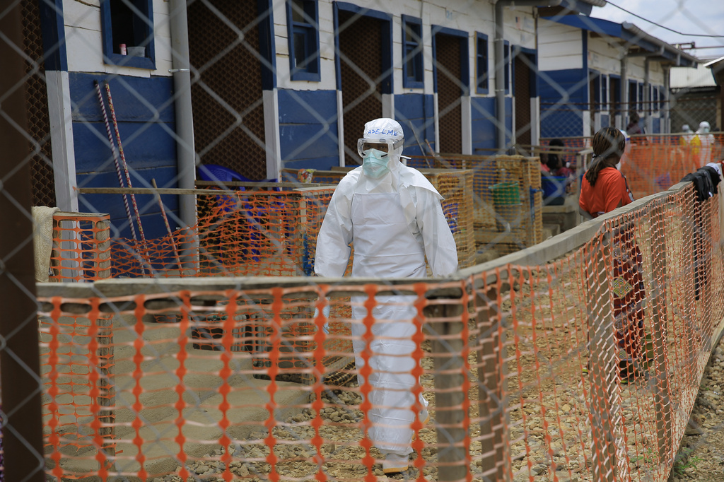 A healthcare worker walks inside a treatment center for Ebola patients in Beni, North Kivu province, eastern Congo, Tuesday, Oct. 27, 2026. (AP Photo/Sebastien Kitsa Musayi)