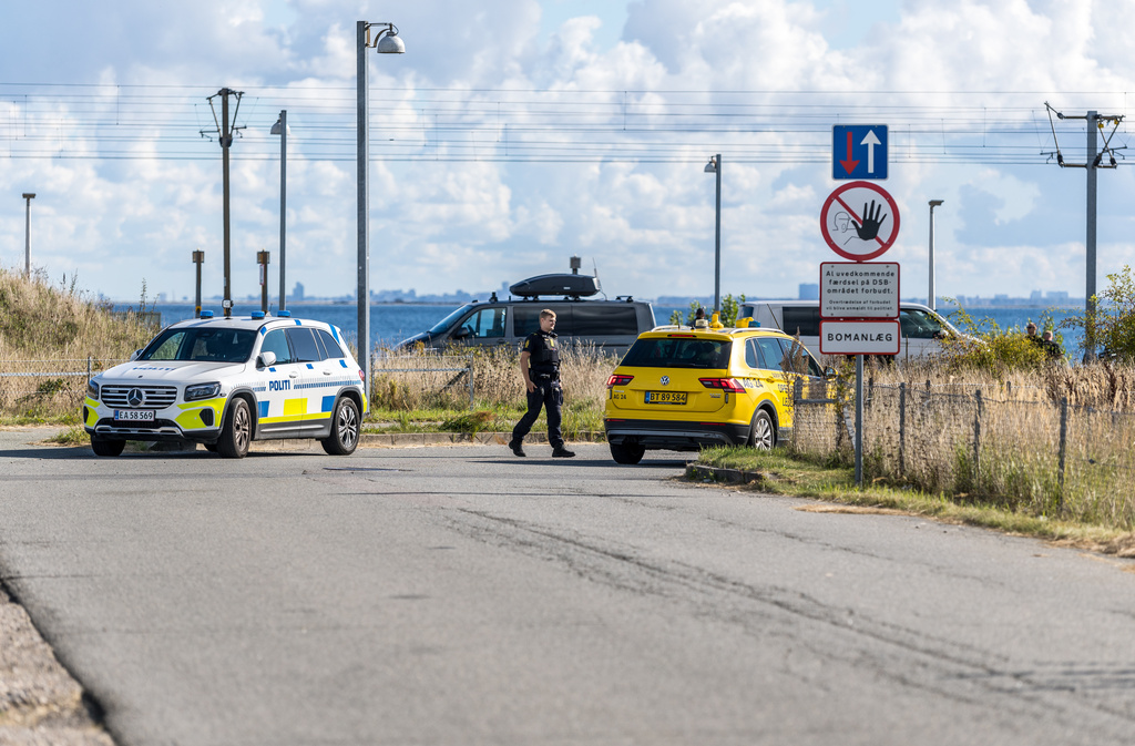 Danish police and Danish Security and Intelligence Service (PET) are present at DSB on Kystvejen by Copenhagen Airport, Tuesday, Sept. 23, 2025, after drones flew over Copenhagen Airport on Monday evening and the airspace was closed for four hours. (Steven Knap/Ritzau Scanpix via AP)