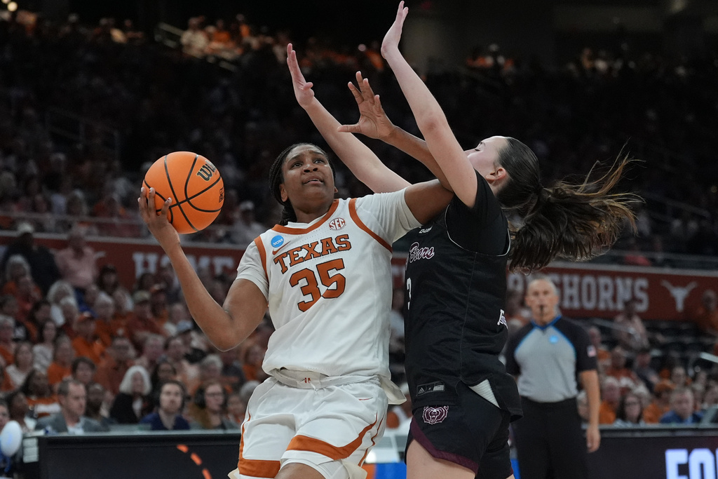 Texas forward Madison Booker (35) drives against Missouri State guard Kendal Brueggen (3) during the second half in the first round of the NCAA college basketball tournament game, Friday, March 20, 2026. (AP Photo/Eric Gay)