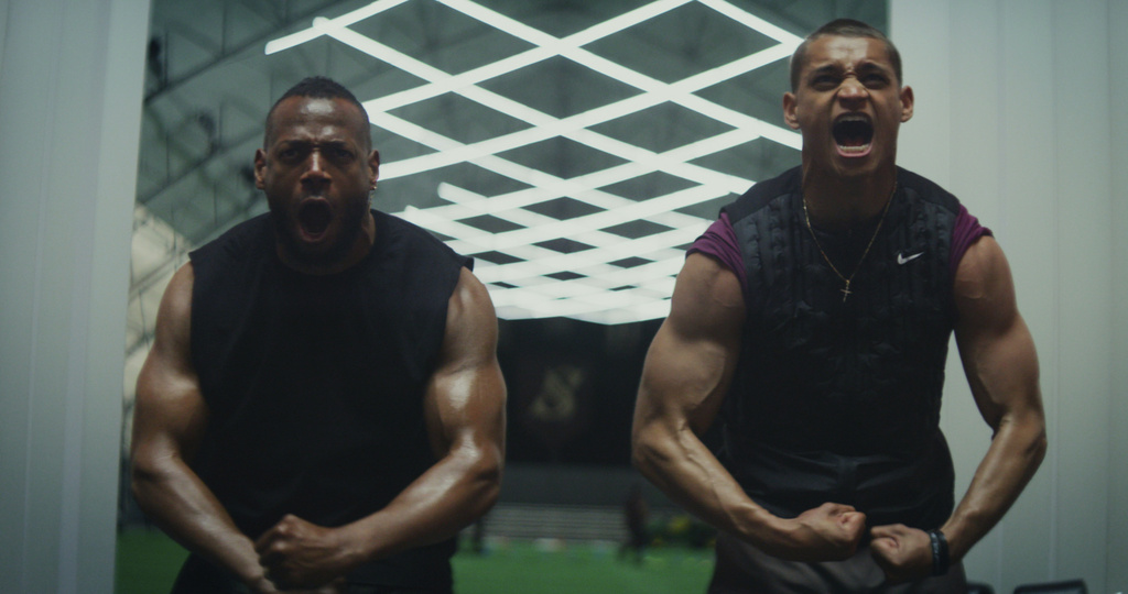 This image released by Universal Pictures shows Marlon Wayans, left, and Tyriq Withers in a scene from "Him." (Universal Pictures via AP)