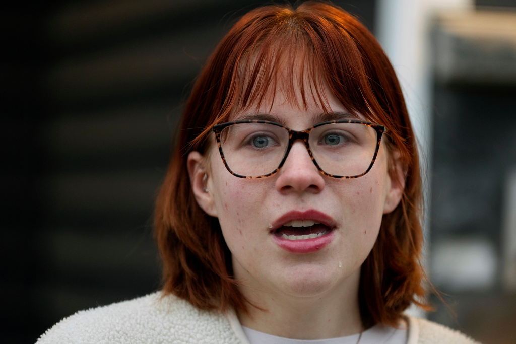 Keira Coady talks about her brother, Sgt. Declan Coady, 20, of West Des Moines, Iowa, outside her home, Tuesday, March 3, 2026, in West Des Moines, Iowa. (AP Photo/Charlie Neibergall)