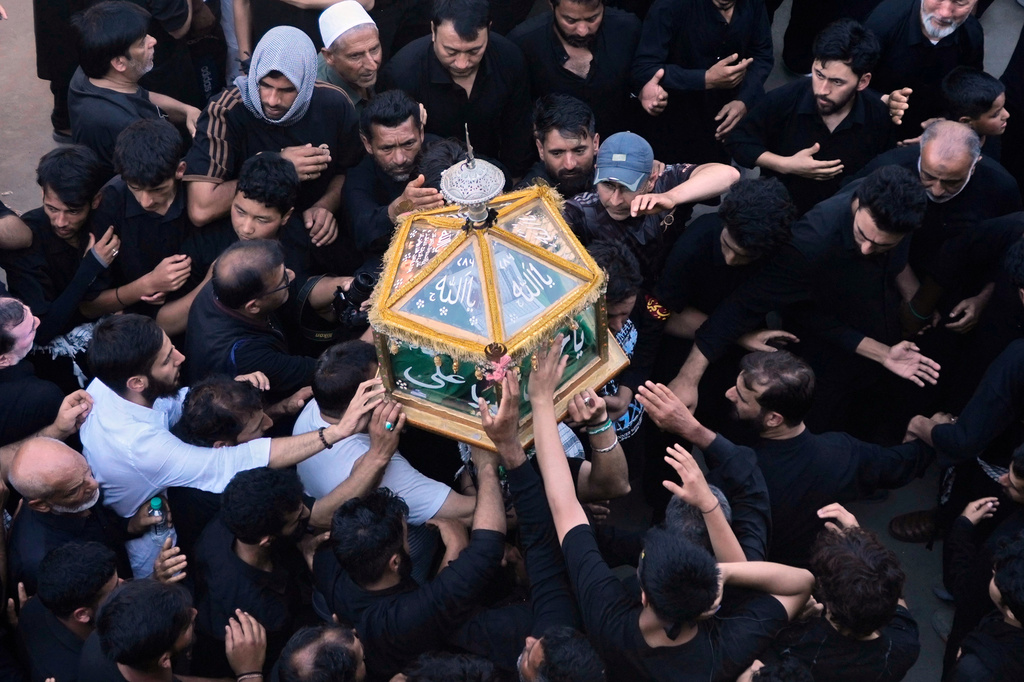 Kashmiri Shiite Muslims participate in a Muharram procession in Srinagar, Indian controlled Kashmir, Tuesday, June 23, 2026. (AP Photo/Mukhtar Khan)