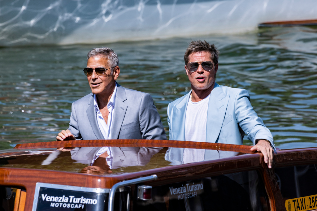 FILE - George Clooney, left, and Brad Pitt upon arrival for the press conference of the film 'Wolfs' during the 81st edition of the Venice Film Festival in Venice, Italy, on Sept. 1, 2024. (Photo by Joel C Ryan/Invision/AP, File)