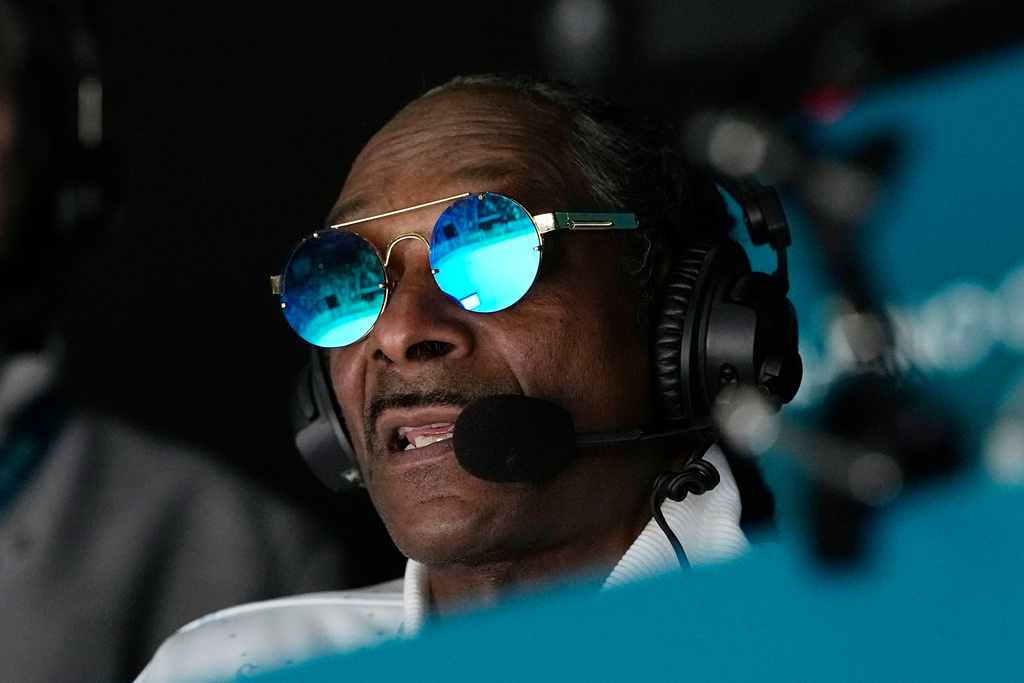 Snoop Dogg attends a men's ice hockey quarterfinal game between the United States and Sweden at the 2026 Winter Olympics, in Milan, Italy, Wednesday, Feb. 18, 2026. (AP Photo/Hassan Ammar)