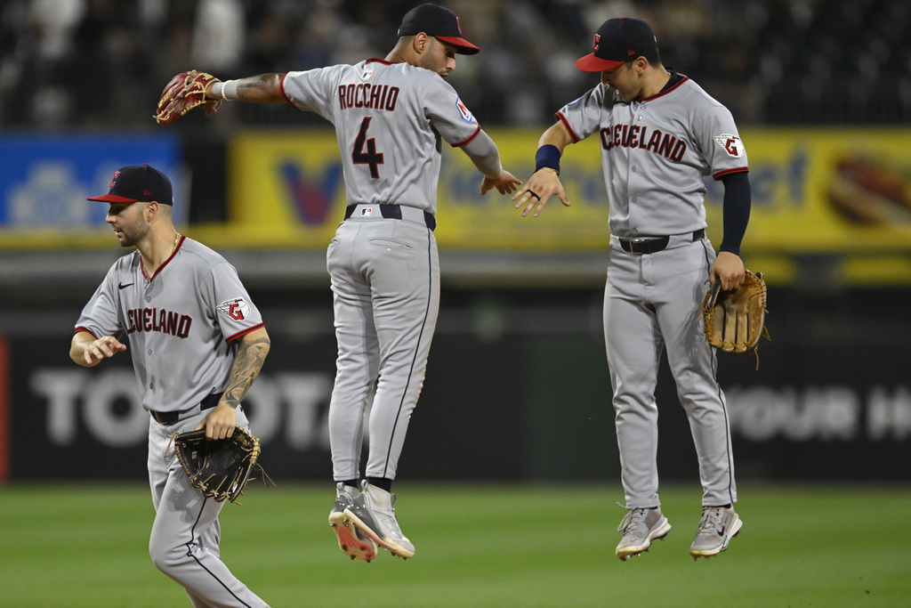 Cleveland Guardians' Steven Kwan, right, celebrates with teammate Brayan Rocchio (4) after defeating the Chicago White Sox in a baseball game Saturday, Aug. 9, 2025, in Chicago. (AP Photo/Paul Beaty)