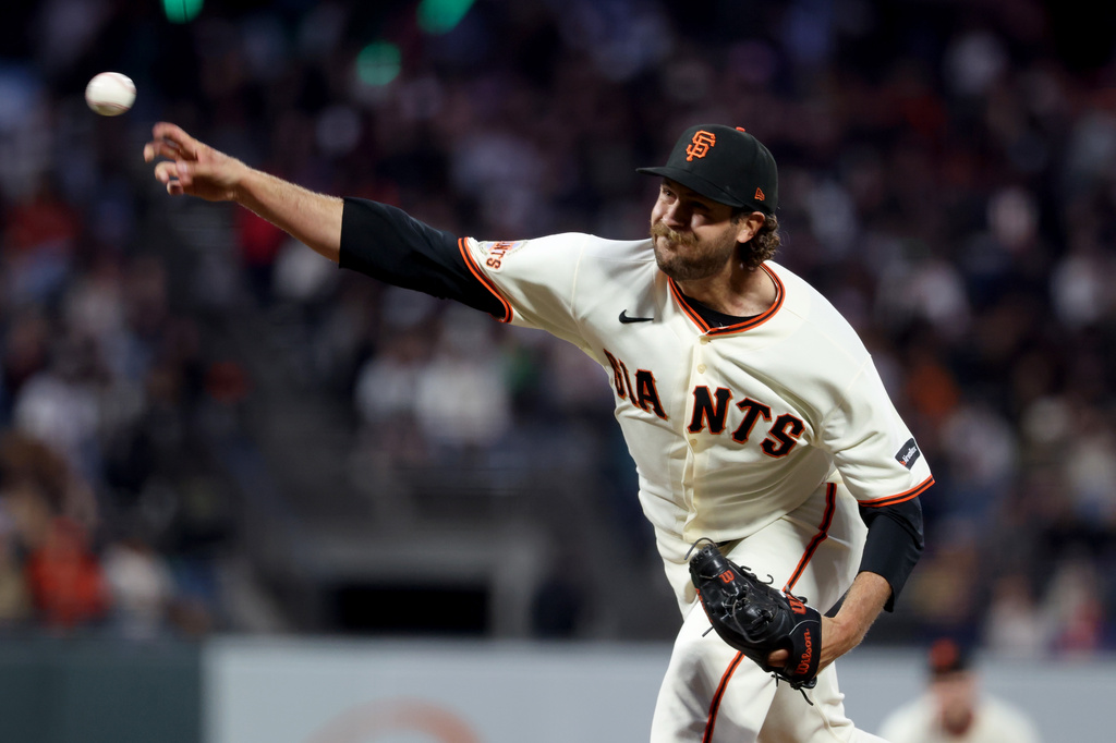 San Francisco Giants pitcher Jason Foley throws against the Cincinnati Reds during the fourth inning of a baseball game in San Francisco, Monday, Aug. 24, 2026. (AP Photo/Jed Jacobsohn)