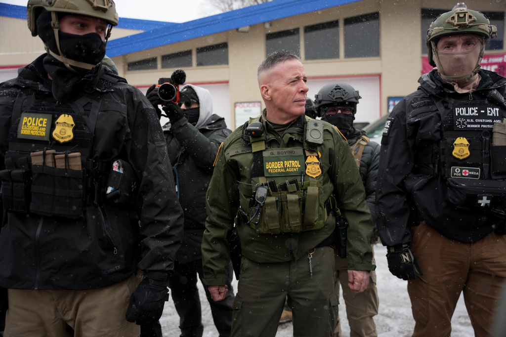 FILE - U.S. Border Patrol Cmdr. Gregory Bovino walks with Federal agents outside a convenience store Jan. 21, 2026, in Minneapolis. (AP Photo/Angelina Katsanis, File)