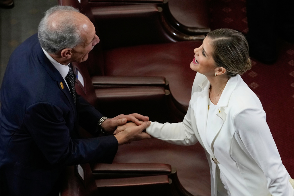 FILE - Honduran President Nasry Asfura, left, and Costa Rica President-elect Laura Fernandez shake hands during the inauguration ceremony of Chile's President Jose Antonio Kast, in Valparaiso, Chile, March 11, 2026. (AP Photo/Esteban Felix, File)