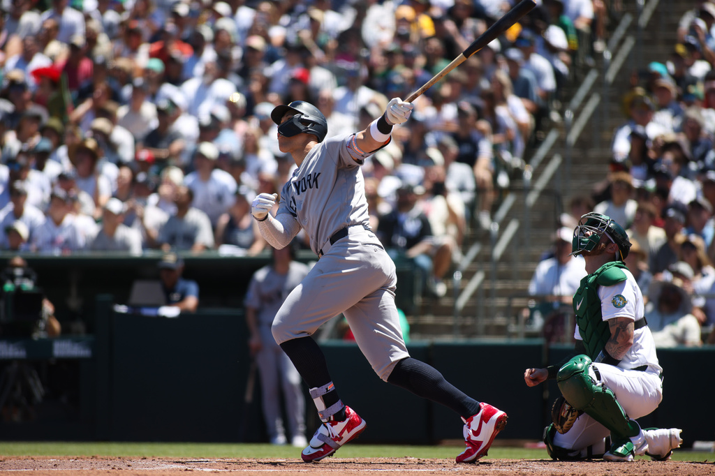 New York Yankees' Aaron Judge hits an RBI single during the third inning of a baseball game against the Athletics, Sunday, May 31, 2026, in West Sacramento, Calif. (AP Photo/Scott Marshall)