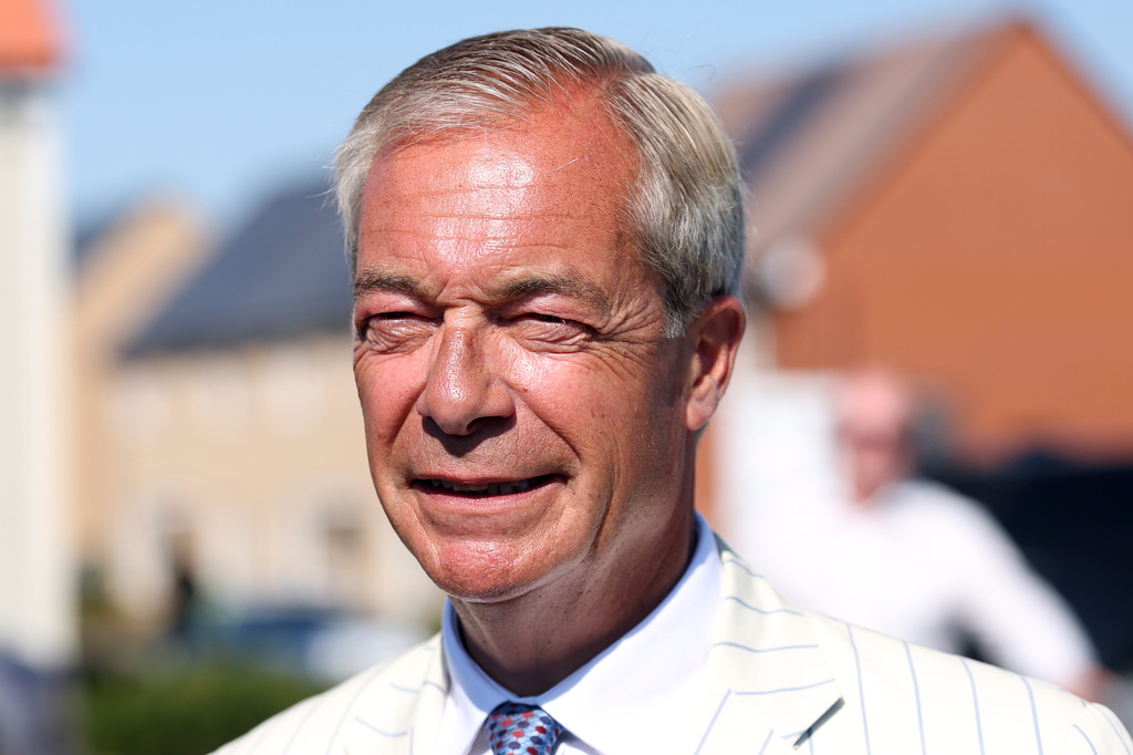 Britain's Reform UK party leader Nigel Farage arrives at a polling station in Walton on the Naze, Thursday, Aug. 13, 2026 to cast his vote for the Clacton on Sea by-election.(AP Photo/Richard Pelham)
