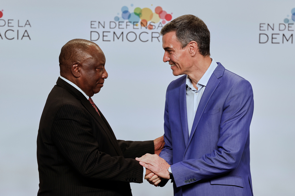 Spain's Prime Minister Pedro Sanchez, right, greets South African President Cyril Ramaphosa, at the Meeting in Defence of Democracy summit, in Barcelona, Spain, Saturday, April 18, 2026. (AP Photo/Joan Monfort)