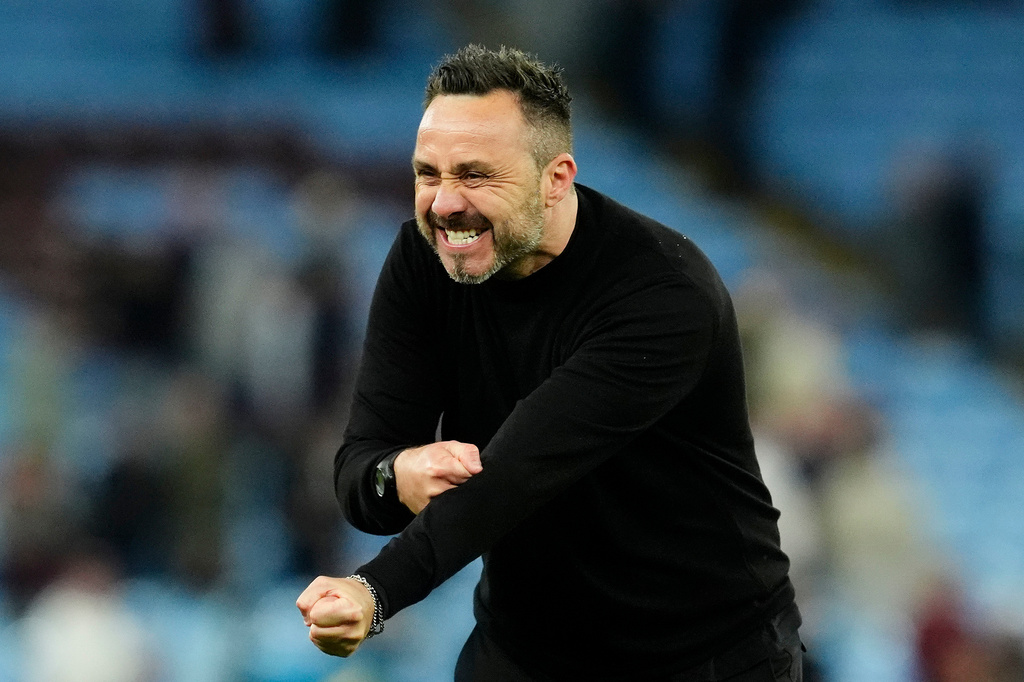 Tottenham Hotspur manager Roberto de Zerbi celebrates after the English Premier League soccer match between Aston Villa and Tottenham Hotspur in Birmingham, England, Sunday, May 3, 2026. (Nigel French/PA via AP)