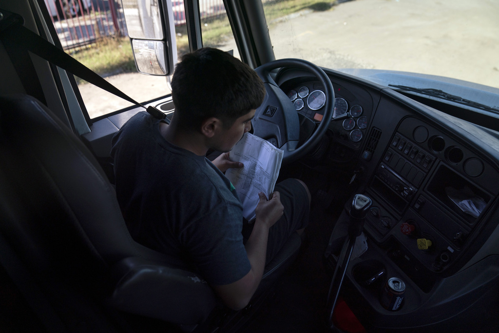 FILE - Student driver Edgar Lopez, 23, prepares for a practice driving session at California Truck Driving Academy in Inglewood, Calif., Monday, Nov. 15, 2021. (AP Photo/Jae C. Hong), File)