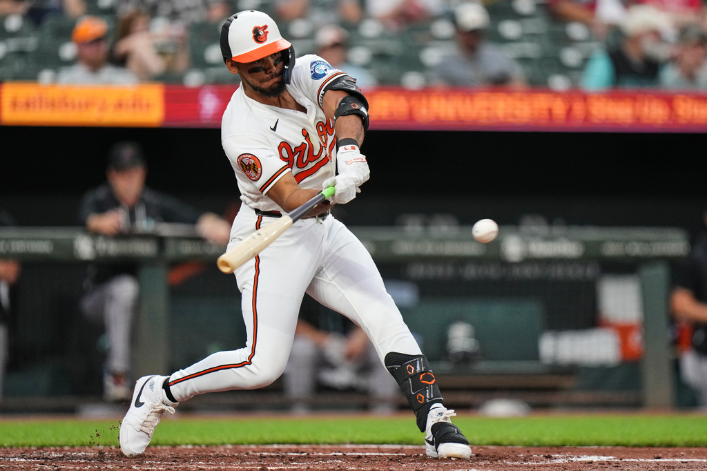 Baltimore Orioles' Jeremiah Jackson hits a single during the second inning of a baseball game against the Arizona Diamondbacks, Tuesday, April 14, 2026, in Baltimore. (AP Photo/Stephanie Scarbrough)