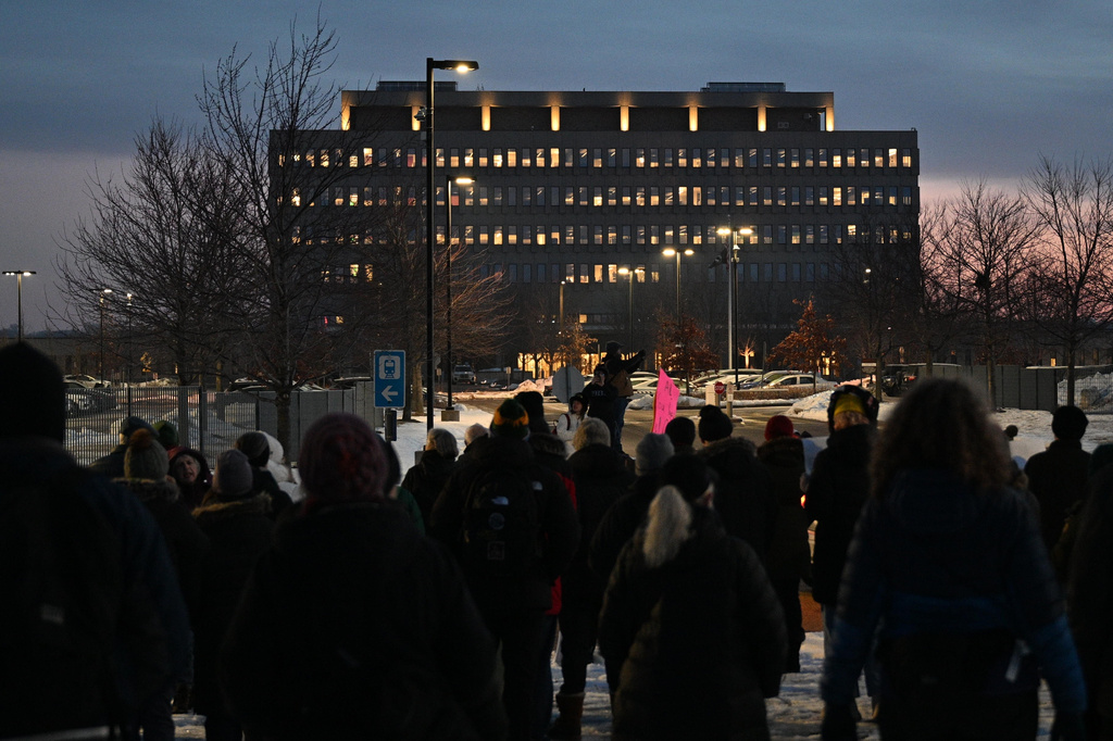 FILE - Protesters gather outside the Bishop Henry Whipple Federal Building, Jan. 8, 2026, in Minneapolis, Minn. (AP Photo/Tom Baker, File)