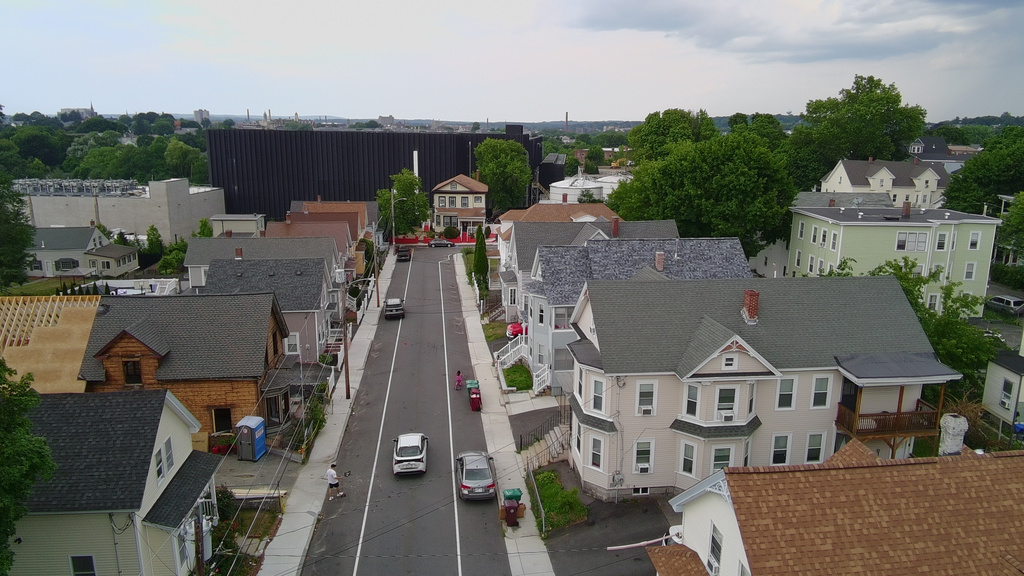 A data center and its backup diesel generators built by the Markley Group loom over a ballpark and residential neighborhood in Lowell, Mass., on June 30, 2026. (AP Photo/Matt O'Brien)