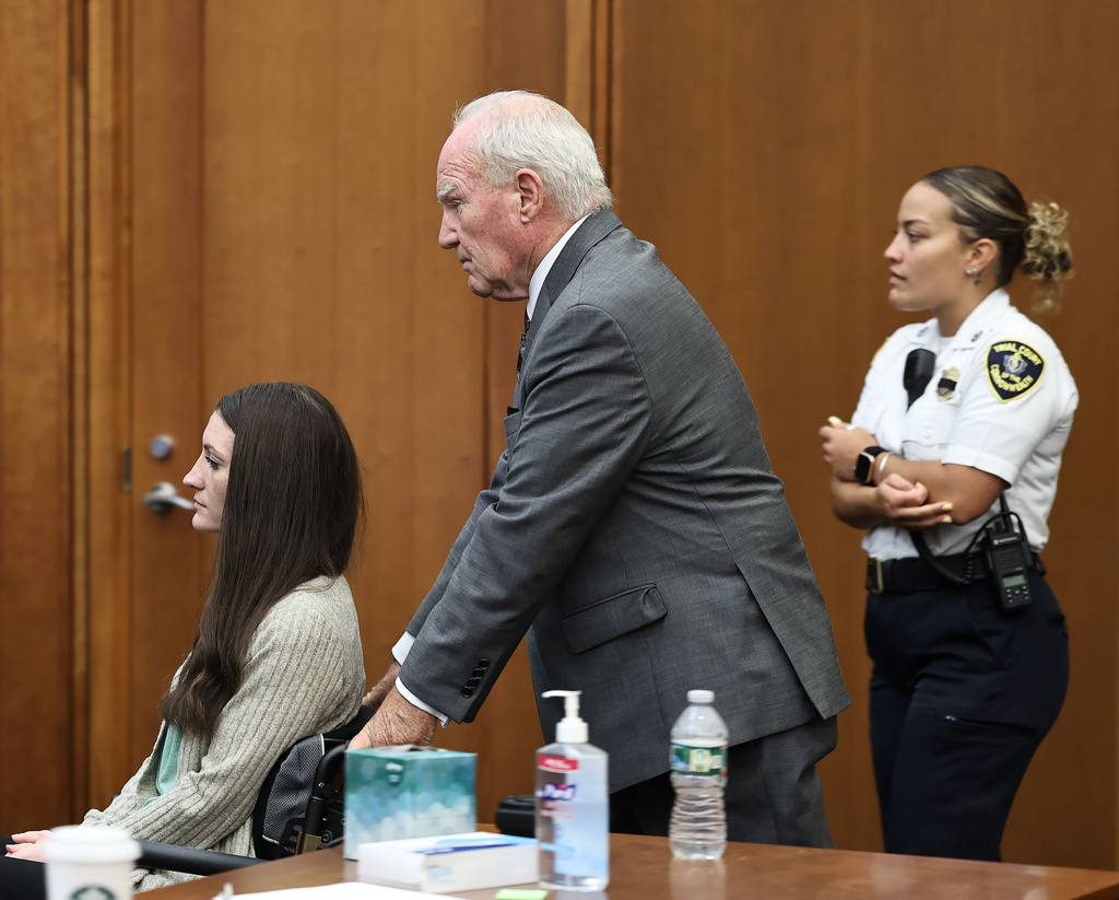 Defense attorney Kevin Reddington pushes the wheelchair of Lindsay Clancy for a sidebar with the judge during her trial in Plymouth, Mass., on Thursday, Sept. 3, 2026. (Greg Derr/The Patriot Ledger via AP, Pool)