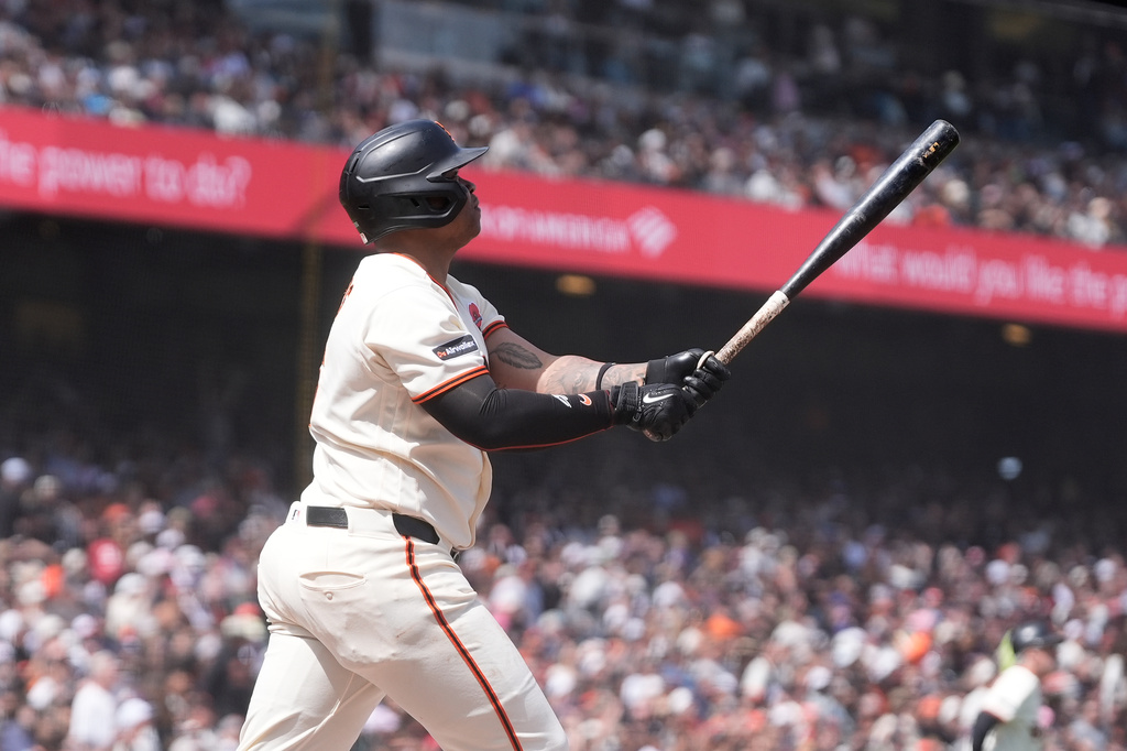 San Francisco Giants' Rafael Devers watches his two-run double during the fourth inning of a baseball game against the Arizona Diamondbacks Monday, May 25, 2026, in San Francisco. (AP Photo/Jeff Chiu)