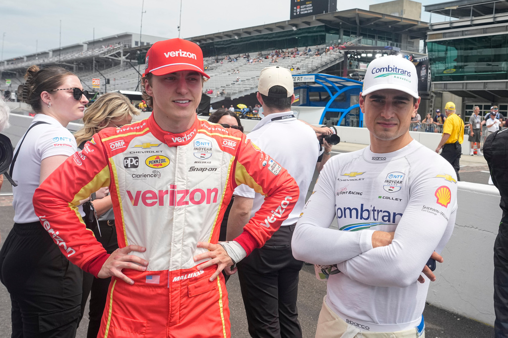 David Maluka, left, talks with Caio Collet before practice for the Indianapolis 500 auto race at the Indianapolis Motor Speedway in Indianapolis, Monday, May 18, 2026. (AP Photo/Michael Conroy)